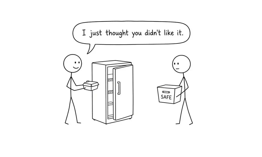 tick-figure comic of two coworkers at an office refrigerator. One offers leftover food; the other holds a bin labeled SAFE. Caption: I just thought you didn’t like it.