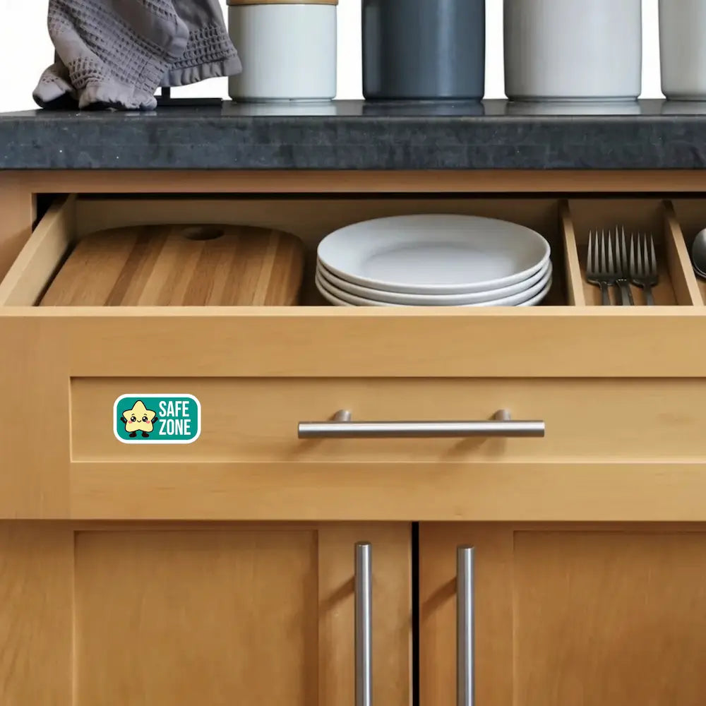 Safe sticker on a kitchen drawer front, marking a FARE-recommended food allergy safety zone for dedicated cutting board, plates and utensils.