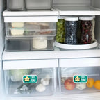 Safe sticker on refrigerator crisper drawers holding produce, showing designated allergen-free storage in an organized fridge.
