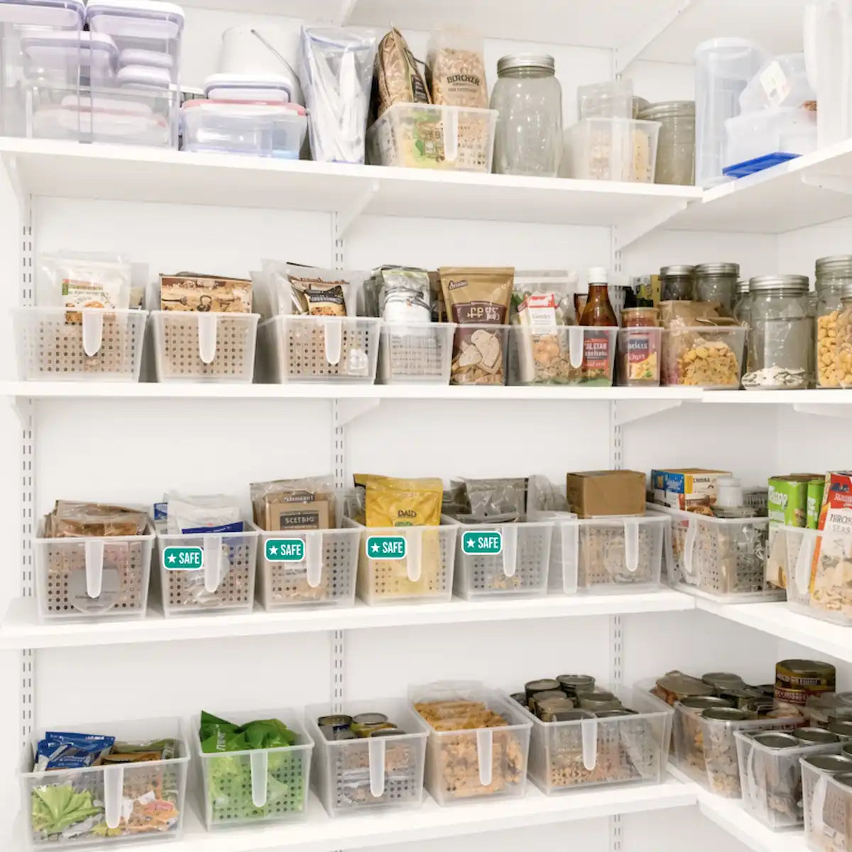 Food allergy safe zone stickers on clear pantry bins, labeling designated allergen-free shelves and containers in an organized kitchen pantry.