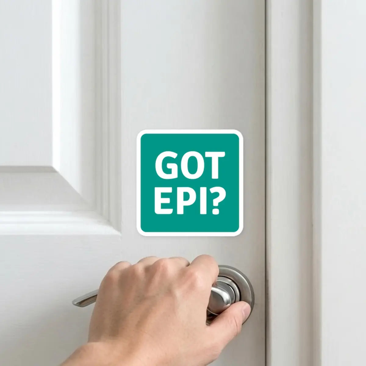 GOT EPI? allergy reminder sticker on white door near doorknob – daily visual cue for anaphylaxis patients to carry epinephrine