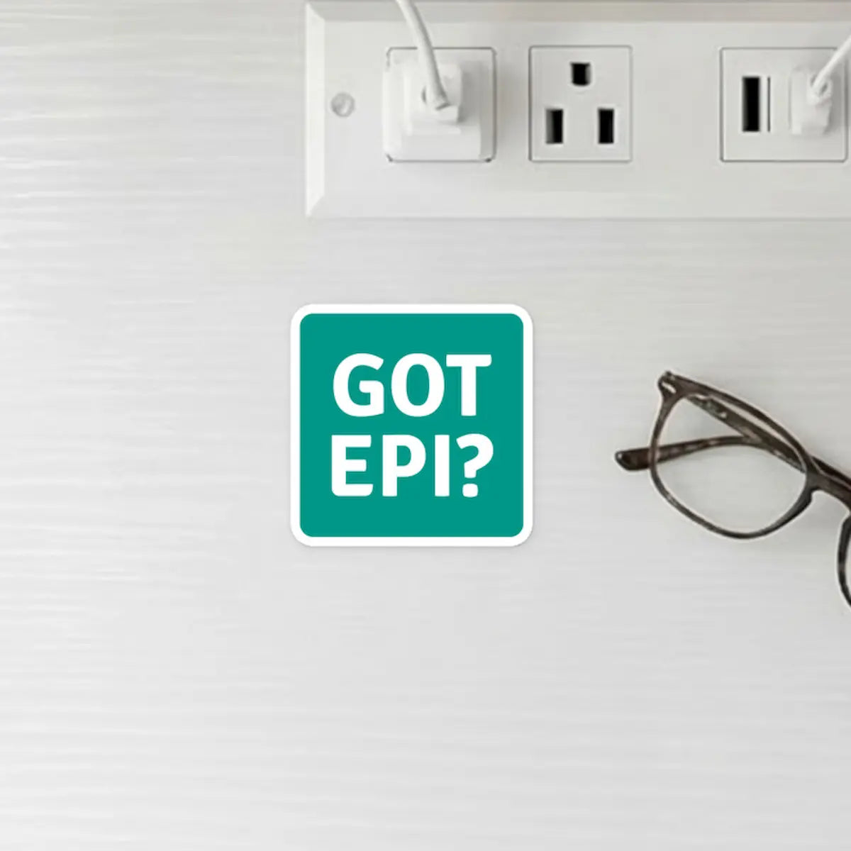 GOT EPI? allergy reminder sticker on nightstand next to glasses and outlet – practical allergy safety reminder for home use
