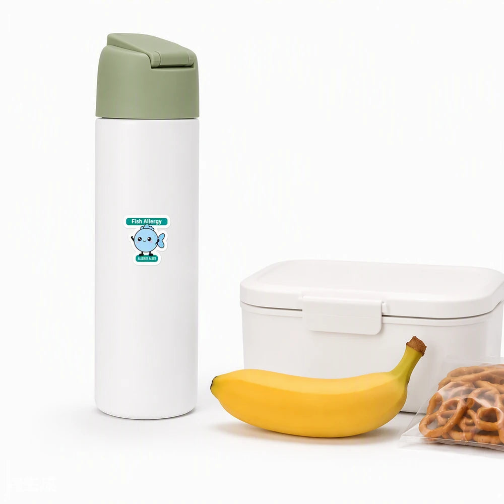 A cartoon fish allergy alert sticker on a white water bottle, making fish allergy information easy to see during school meals, snacks, travel, and group activities.
